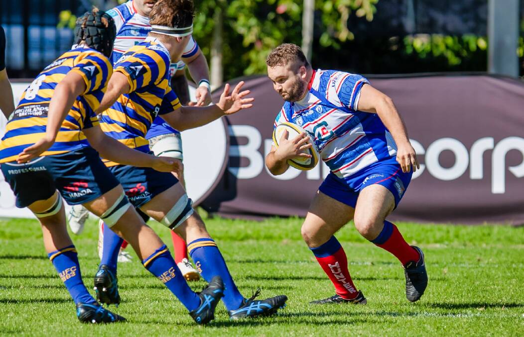 Lachlan Hodges hits the ball up against Sydney University. The prop made his run-on debut against West Harbour. Picture by Stewart Hazell