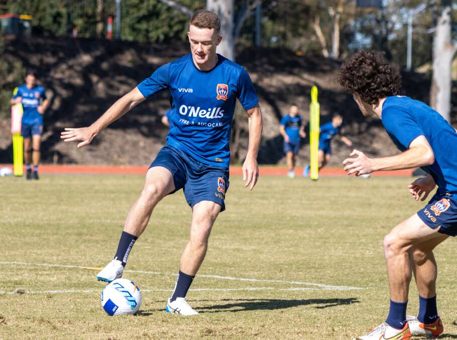 ON THE BALL: Newcastle Jets recruit Brandon O'Neill takes on Mark Natta at training on Friday. Picture: Jets Media