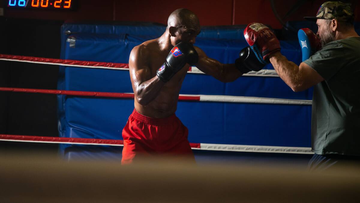 HARD WORK: Sakio Bika hits the pads during a session with Rob Atherton at the Lake Macquarie PCYC ahead of his fight against Adam Stowe. Picture: Marina Neil