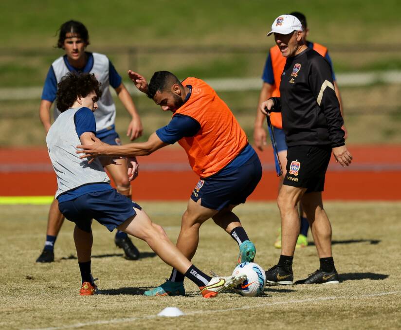 Teenage centreback Mark Matta (left) makes a tackle on Mo Al-Taay at Jets training in Maitland. Natta is in contention to play in the season opener. Picture by Jonathan Carroll