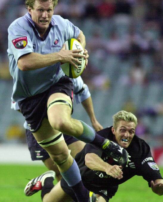 ON THE CHARGE: Stuart Pinkerton in action for the NSW Waratahs. Picture: AAP
