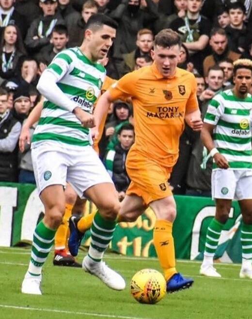 MARKED MAN: Bobby Burns moves in to close down Celtic and Socceroos attacker Tom Rogic. 