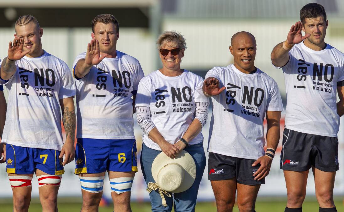 TAKING A STAND: Hamilton and Maitland players vow to say no to domestic violence as part of the "Got Your Back Sista" program at Passmore Oval on Saturday. Picture: Stewart Hazell