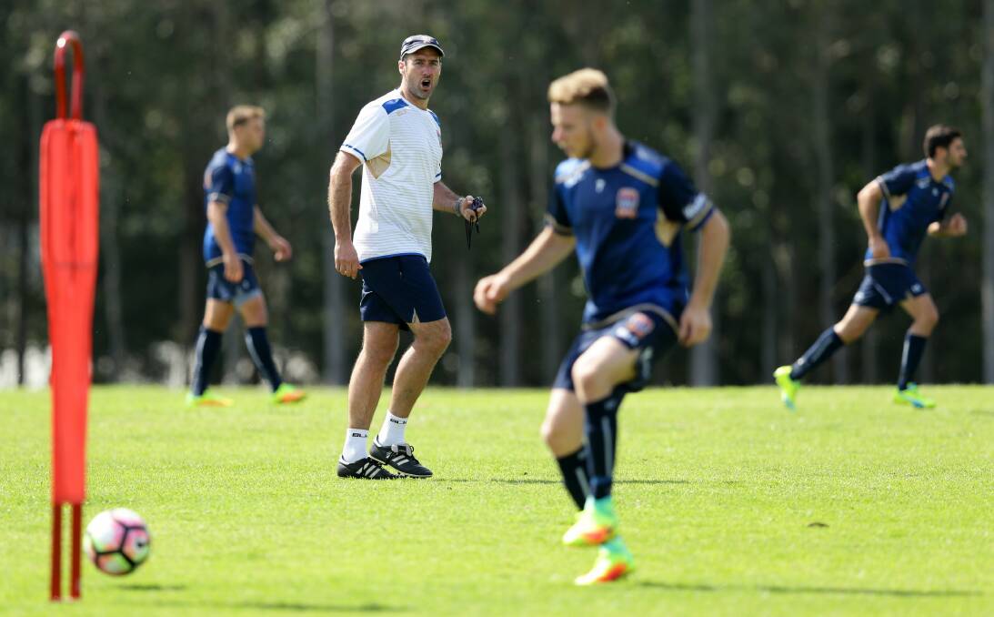 IN CHARGE: Youth team coach Clayton Zane puts the Jets A-League squad through their paces on Friday. Picture: Jonathan Carroll