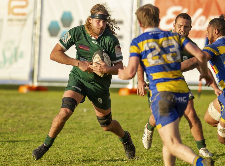 MOVING FORWARD: Merewether centre-turned-lock Lachlan Milton carts the ball up in the Greens' 31-14 loss to Hamilton at Townson Oval. Picture: Stewart Hazell