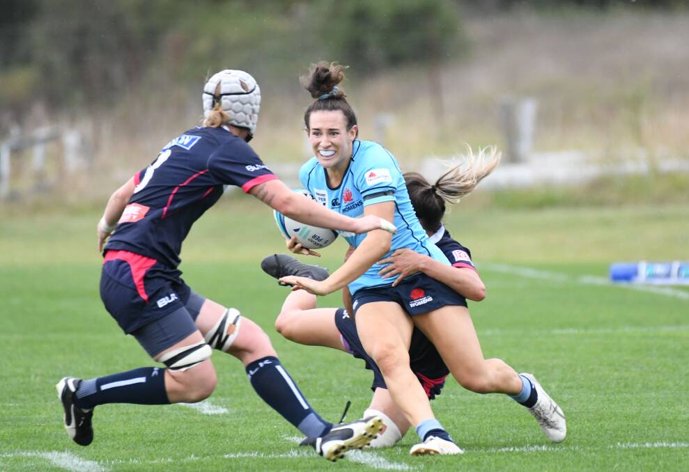 LEARNING: Maya Stewart is tackled playing for NSW against the Melbourne Rebels. 