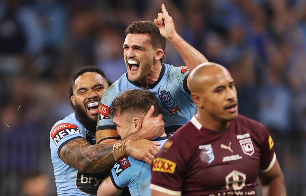 DOMINANT: NSW halfback Nathan Cleary celebrates after scoring in the Blues' 44-12 triumphant over Queensland. Picture: Getty Images 