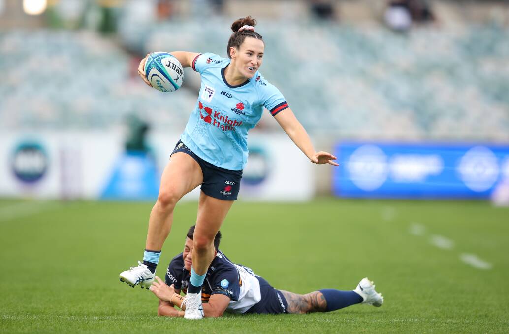 NSW Waratahs winger Maya Stewart skips out of a tackle against the Brumbies. Picture by Sitthixay Ditthavong
