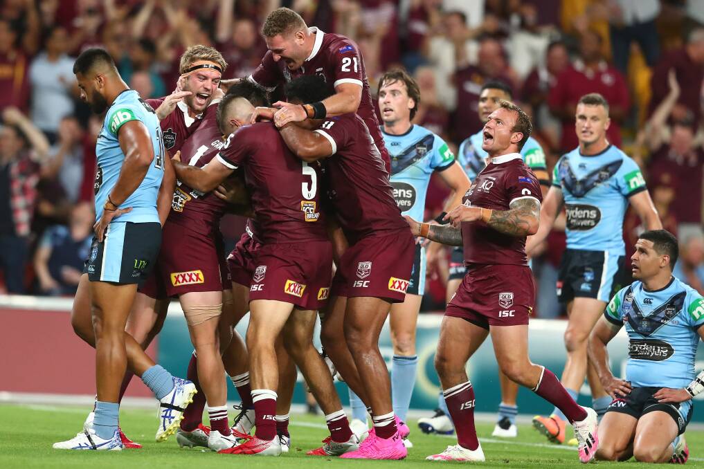 PARTY TIME: Queensland celebrate a try by Harry Grant during their thrilling 20-14 win over NSW to clinch the Origin series at Suncorp Stadium on Wednesday night. Picture: Getty Images