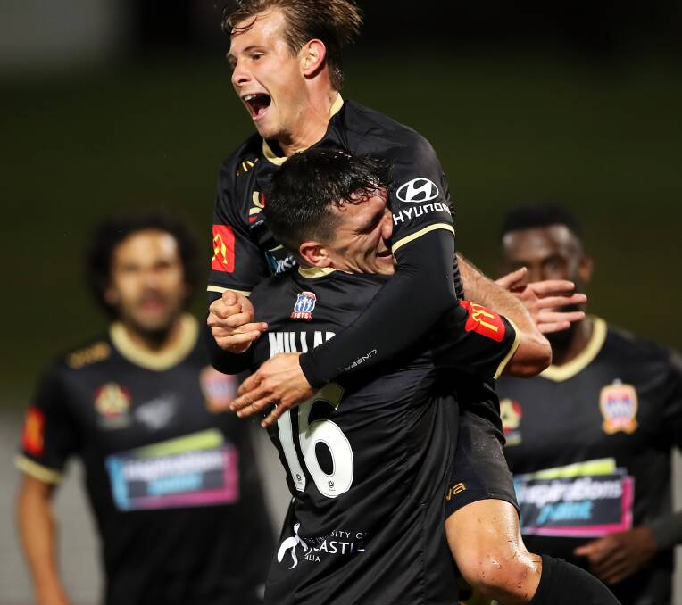 DYNAMIC DUO: Nick Fitzgerald jumps for joy after burying a Matt Millar cross in the 2-1 win over Sydney FC which keeps the Jets in the race for the finals. Picture: Getty Images