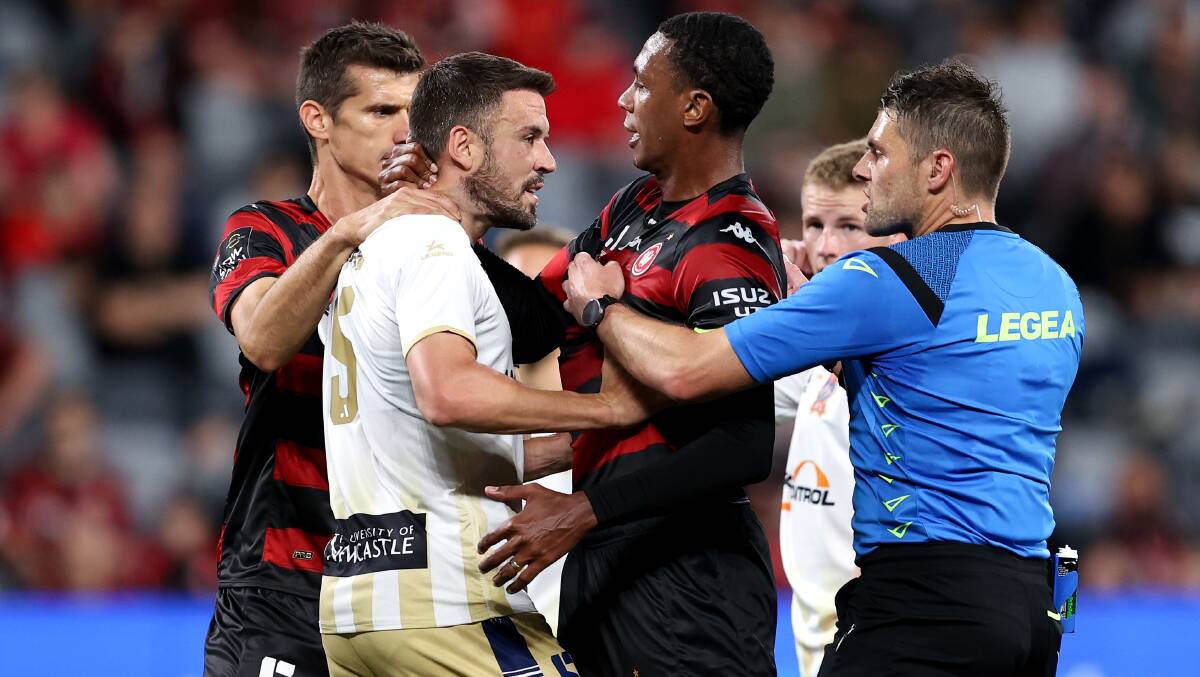 Jets co-captain Matt Jurman exchanges words with Western Sydney opposite Marcelo in the 2-0 loss to wanderers at Comm Bank Stadium on Friday night. Picture Getty Images 
