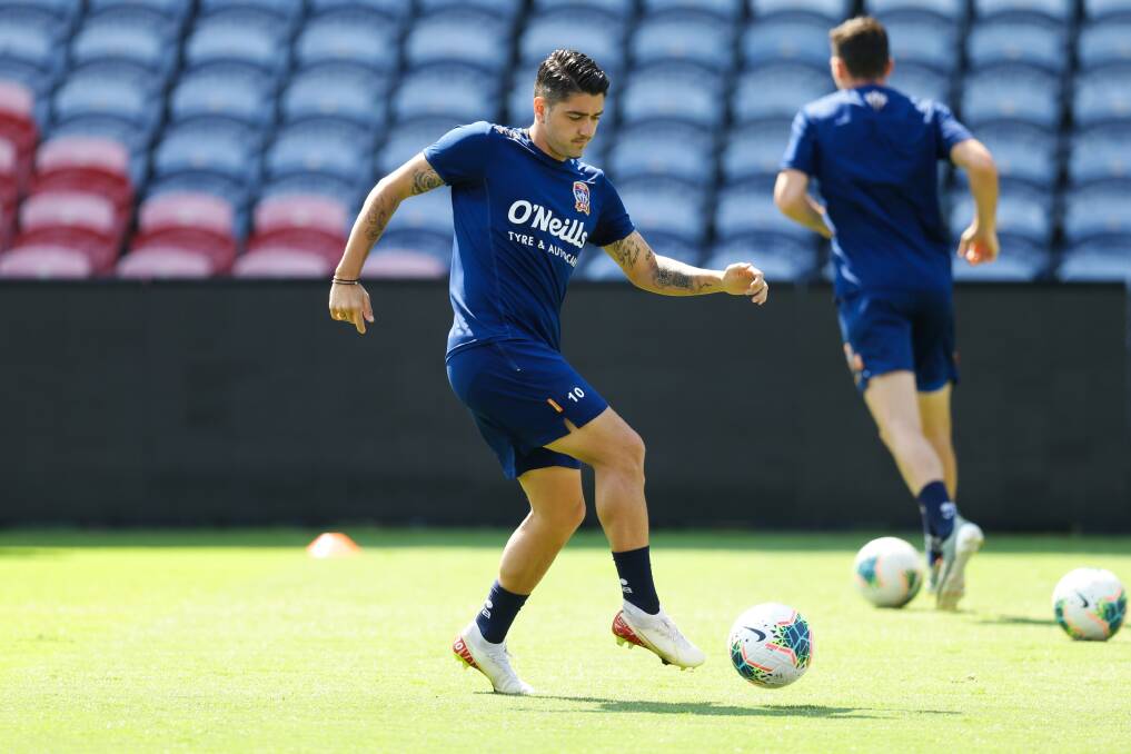 FOCUSED: Dimi Petratos on the ball at Jets training at McDonald Jones Stadium on Friday ahead of the must-win clash with Brisbane. Picture: Jonathan Carroll 