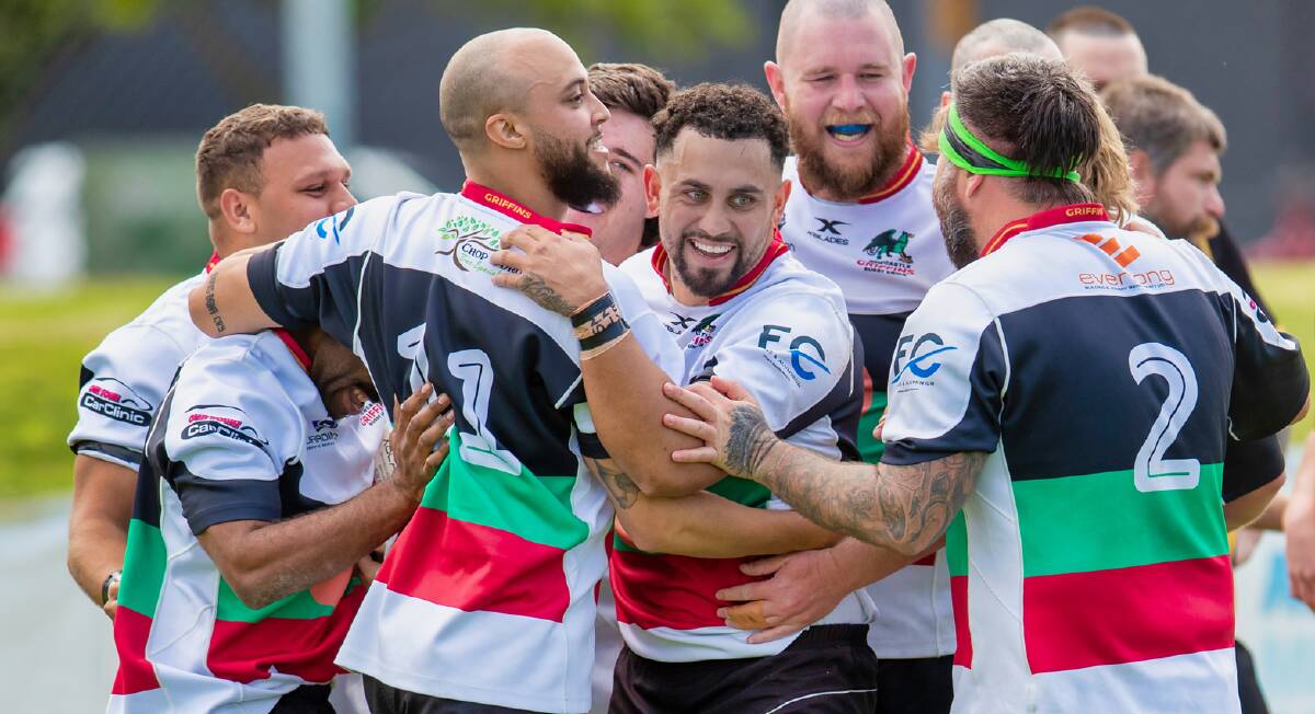 Griffins teammates congratulate Chris Smith (centre) after the fullback scored a try in the win over Medowie in the major semi-final. Picture by Stewart Hazell