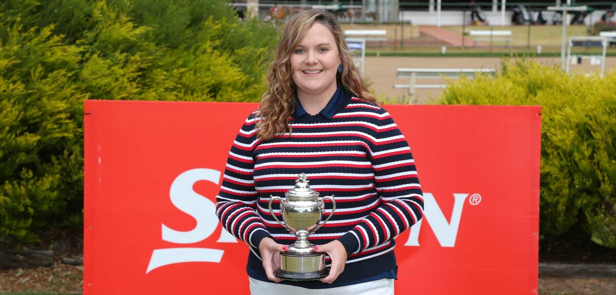 ALL SMILES: Merewether club champion Stacie McDonald with the trophy for winning the NSW Mid Amateur at Yarrawonga. Picture: David Tease (Golf NSW)