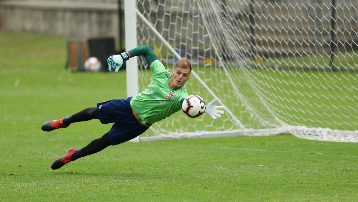 STRONG HAND: Lewis Italiano makes a save at Jets training. Picture: Jonathan Carroll