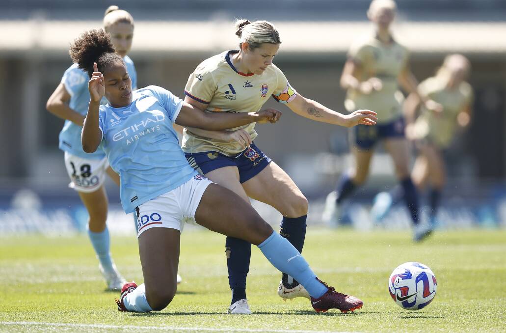 Jets captain Cassidy Davis challenges Naomi Thomas-Chinnama for the ball in the 5-1 loss to Melbourne City. Picture Getty Images
