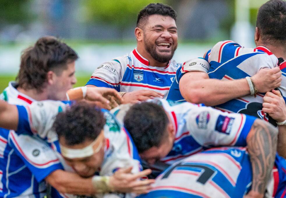 ALL SMILES: Hunter Wildfires hooker Phil Bradford celebrates after a try in the 29-25 win over Easts at No.2 Sportsground on Saturday. Picture: Stewart Hazell