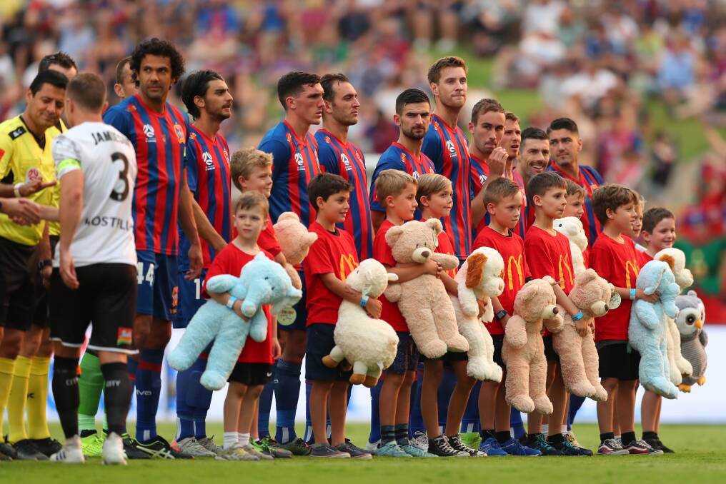 OVERWHELMING SUCCESS: The Jets' mascots with some of the 1414 teddy bears which were donated to charity. Picture: Getty Images 
