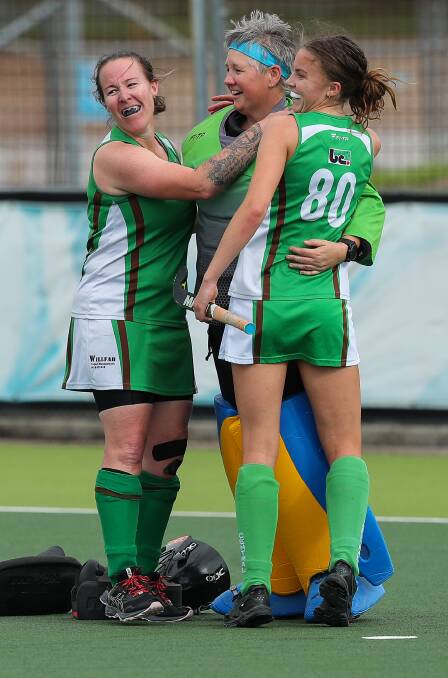 STANDING TALL: Janna Purdon (centre) is congratulated by her Central teammates. Picture: Max Mason-Hubers