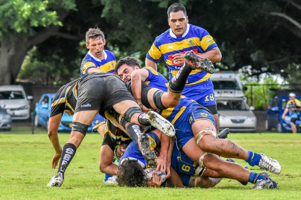 STRONG START: Kiwi recruit Taufa Kinikini cleans out at the breakdown during the Hawks' 57-19 win over Southern Beaches. Picture: Pat Gleeson