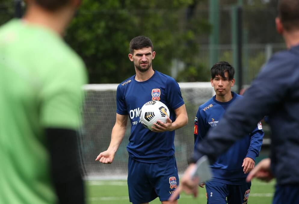 UP TO SPEED: Newcastle Jets midfielder Steve Ugarkovic listens to instructions at training on Tuesday. Picture: Simone De Peak