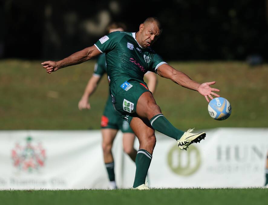 Kurtely Beale puts boot to ball in Randwick's 64-17 win over the Hunter Wildfires. Pictures by Marina Neil