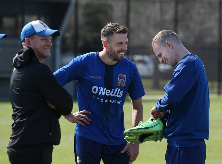 PARTNERS: Jets centrebacks Jordan Elsey (right) and Matt Jurman share a laugh with strength and conditioning coach Brice Johnson at training. Picture: Simone De Peak
