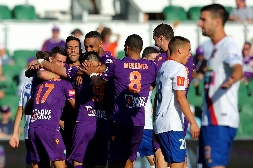 GLORIOUS: Perth players celebrate a goal in the 6-2 win over the Jets. Picture: Getty Images
