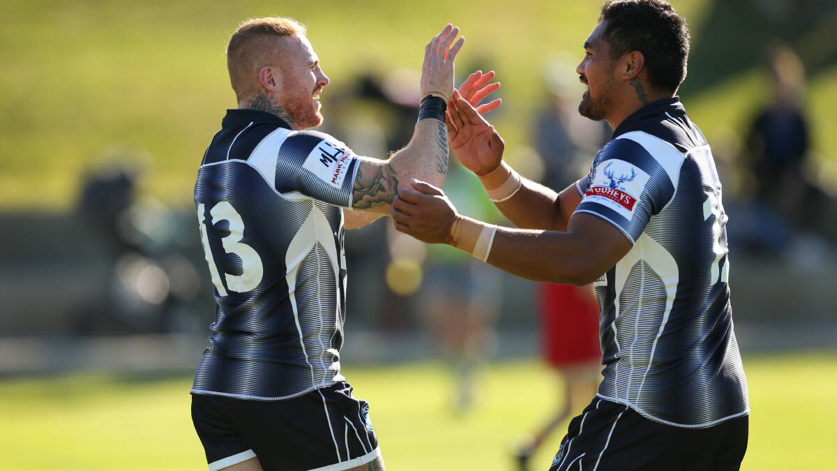 TRY TIME: Mitch Cullen and Pat Pat Mata'utia celebrate after a try in Newcastles' 30-20 win over the Ron Massey Cup representative team. Picture: Marina Neil