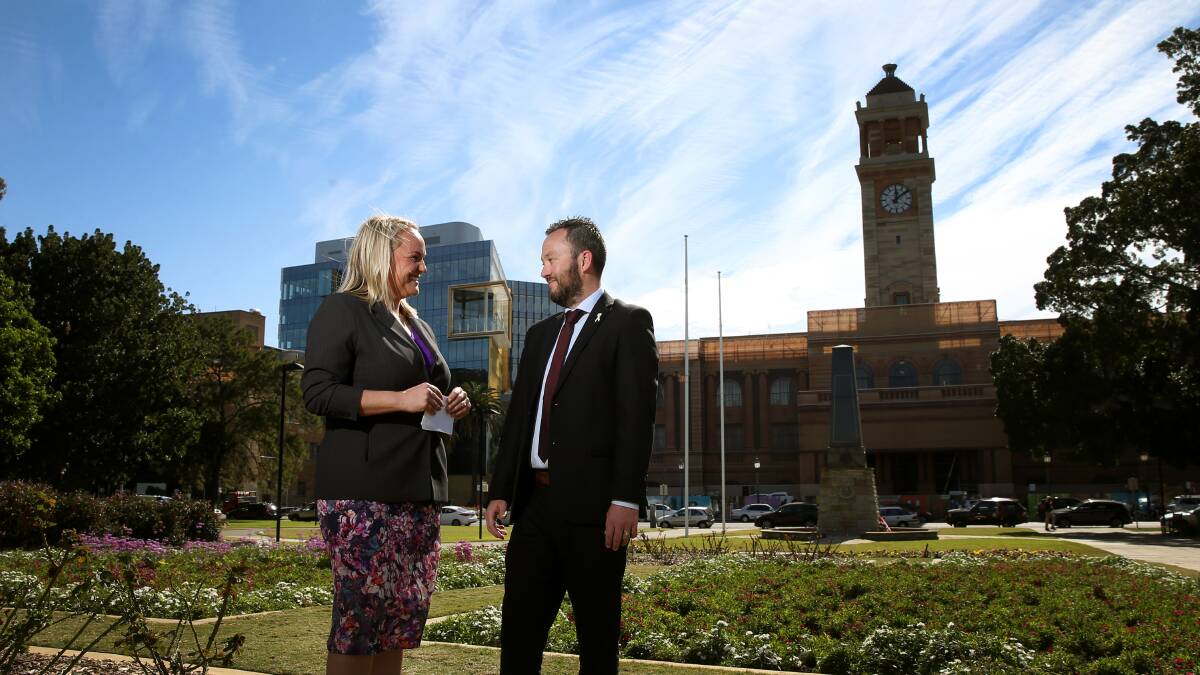 NO OUTSOURCING: Newcastle Lord Mayor Nuatali Nelmes with Luke Hutchinson from the United Services Union in Civic Park on Friday, after signing a pledge not to cut council jobs. PICTURE: Marina Neil