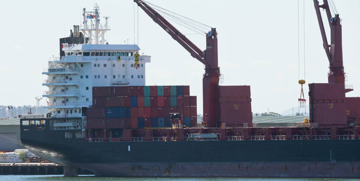 CAPPED: A cargo ship loaded with shipping containers docked in the Port of Newcastle in August. There is a cap on the number of containers that can come through the Port of Newcastle without a charge. PICTURE: Max Mason-Hubers