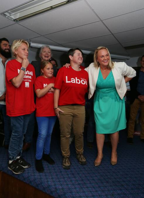 Newcastle Lord Mayor Nuatali Nelmes addresses her supporters at Lambton Bowling Club. Pictured left to right with her son Archie, 15, daughter Ruby-Lou, 10, and Labor's Ward 1 candidate Emma White. PICTURE: Simone De Peak