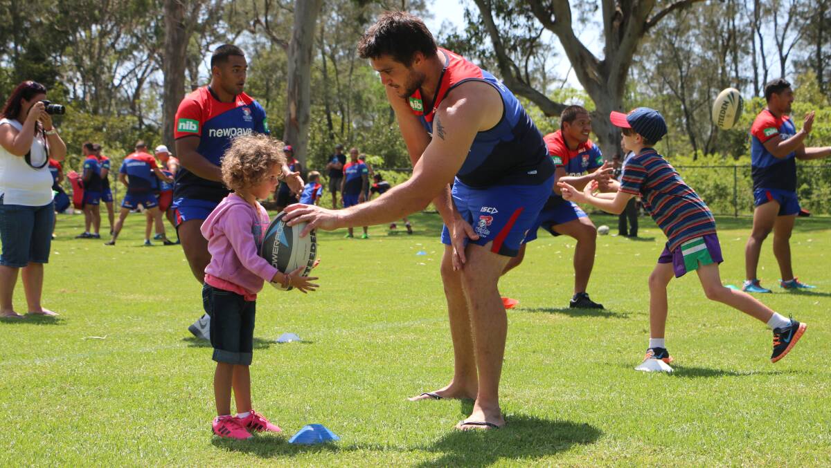 OUTSOURCED: Newcastle Knights player Kade Snowden at the kids training session at Myuna Bay Sport and Recreation Centre's newly upgraded Wally Miles field in 2015. Picture: Jamieson Murphy.