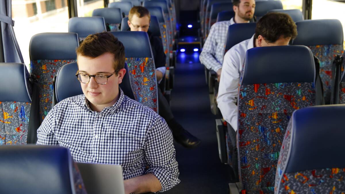 FOUNDER: Matthew George, who created Bridj, on one of the buses his company uses in Cambridge, Massachusetts in 2014. The "pop-up" bus service uses routes dictated by commuter data. PICTURE: Katherine Taylor for The New York Times