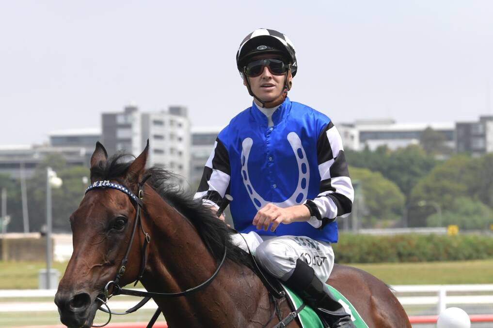 ON BOARD: Jockey Jason Collett wearing the Australian Bloodstock colours on Our Century. Collett will ride Saunter Boy in the Winter Cup on Saturday at Rosehill. Picture: AAP