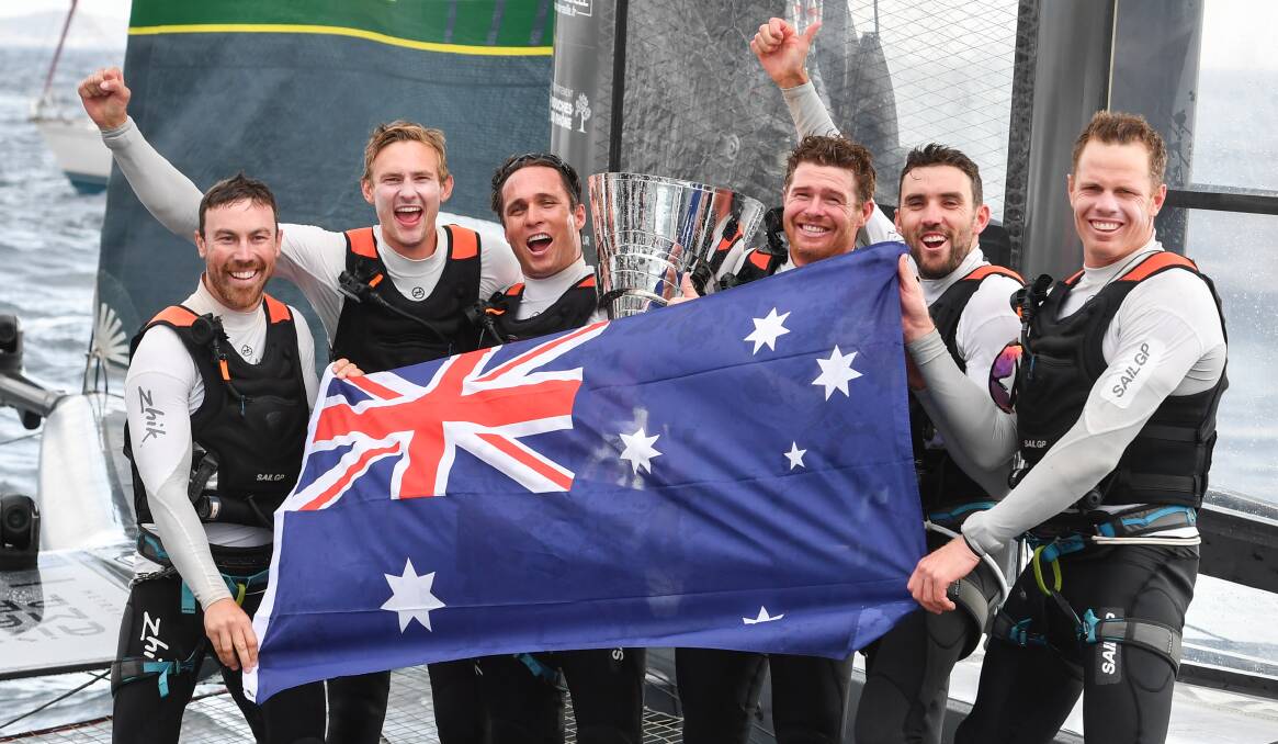 CHAMPIONS: Team Australia, with Kyle Langford second from left, celebrate their victory. Picture: Ricardo Pinto/SailGP.