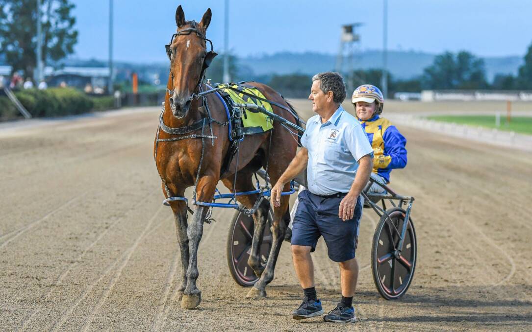 BIG WIN: Owner-breeder Michael Elder with Bright Energy and nephew Brad Elder after their victory at Menangle Park on Saturday night. Picture: Racing at Club Menangle Trackside
