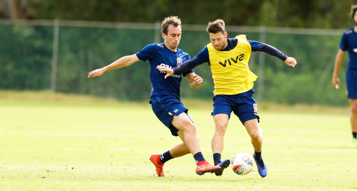 SWITCH: Angus Thurgate, left, will come into consideration to replace the injured Wes Hoolahan, right, in the Jets' starting side this A-League season. Picture: Jonathan Carroll