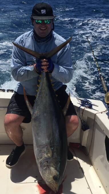 FISH OF THE WEEK: Alex Schmaler-Loomes win the $45 prize from Tackle Power Sandgate for this 40kg yellowfin tuna caught on the shelf on Saturday.
