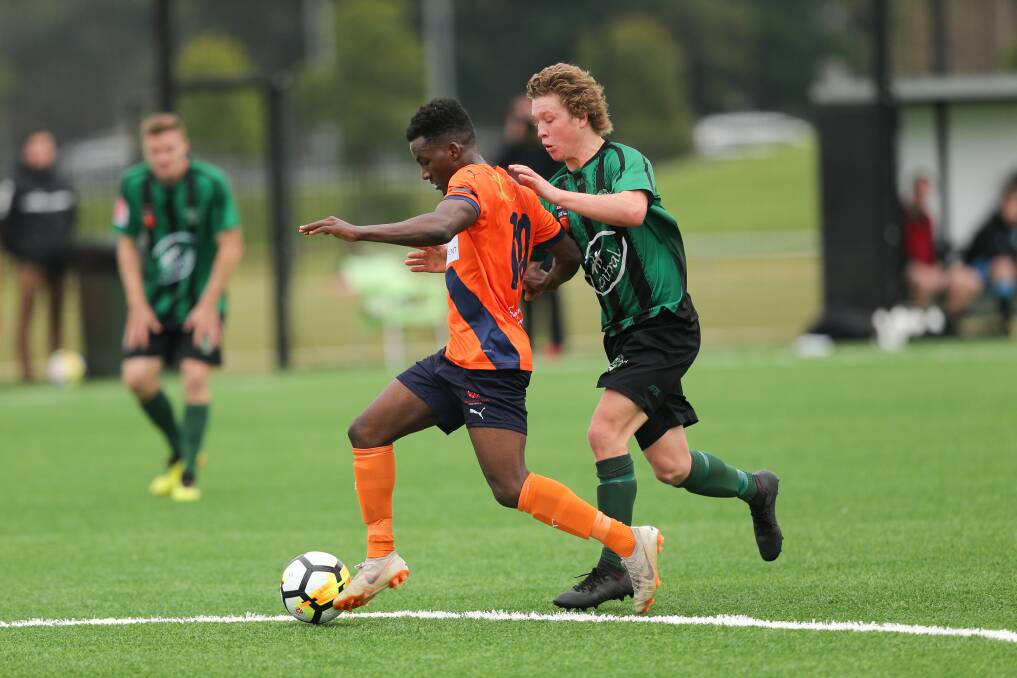Kahibah and Valentine compete on a LMRFF pitch during the FFA Cup this year.