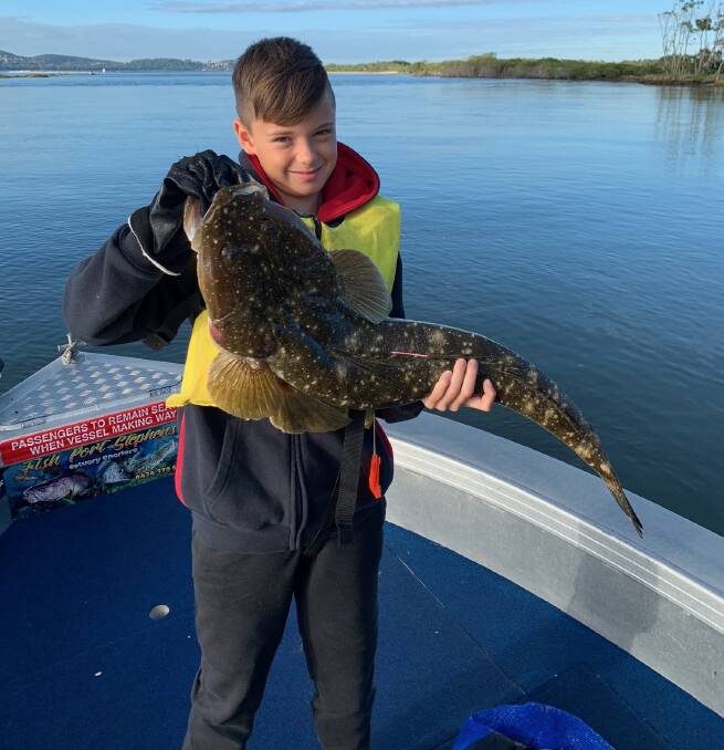 FISH OF THE WEEK: Tyler Mason, 9, from Lemon Tree Passage wins a $45 voucher from Sandgate Tackle Power for this 80cm flathead caught off Port Stephens.