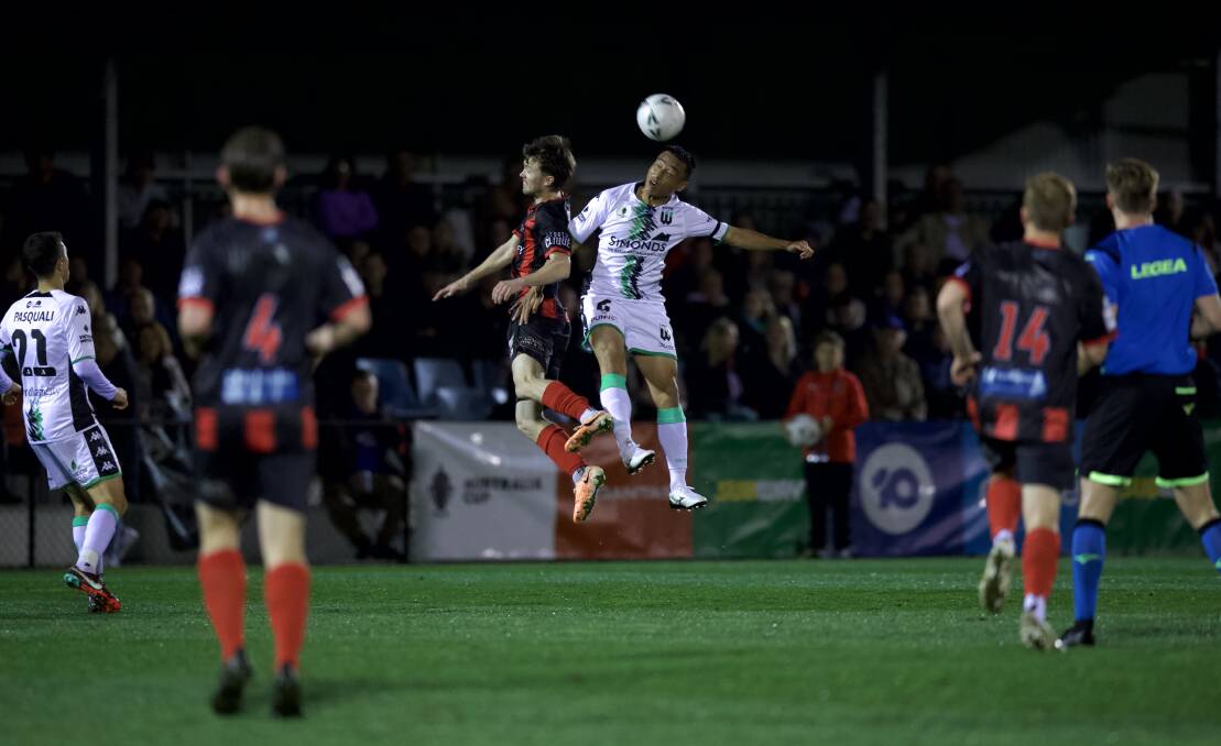 Edgeworth's Tom Curran contests a header with Tomoki Imai on Wednesday night. Picture Sproule Sports Focus