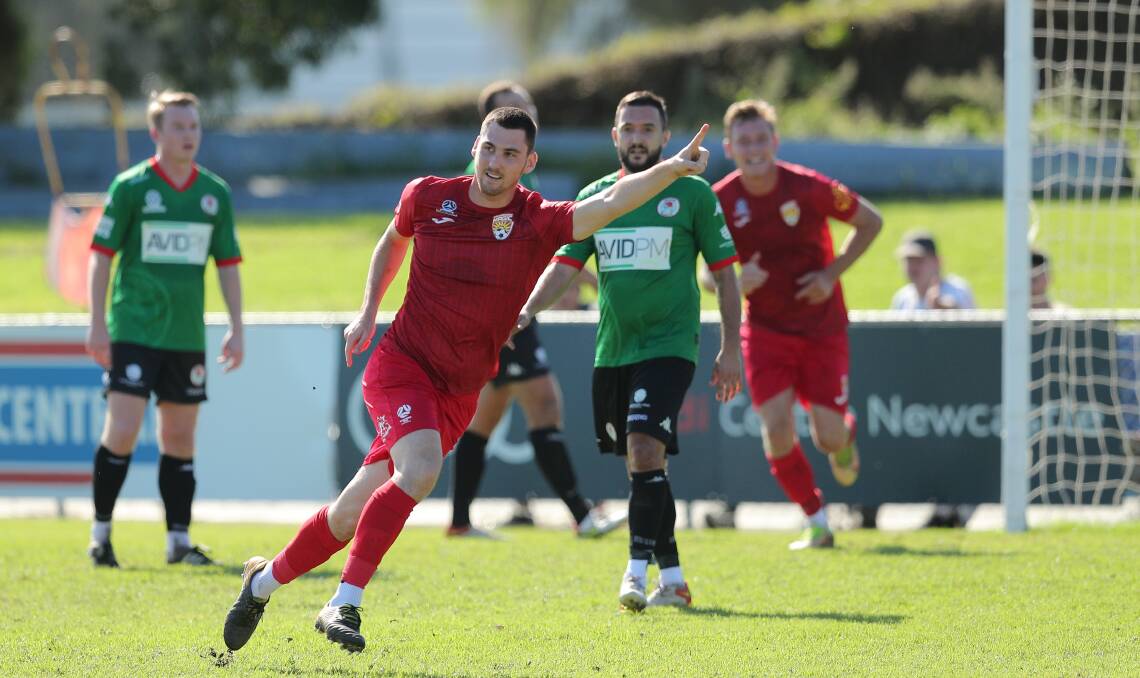 Jacob Dowse celebrates scoring a goal for Broadmeadow this season against Adamstown. Picture by Max Mason-Hubers