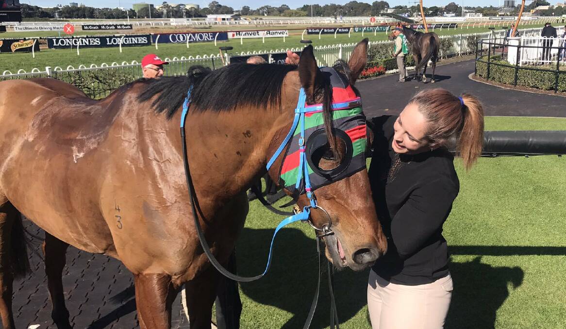 Aleacia Bennett with Buddy Honest after he gave her a maiden city winner. Picture: ATC