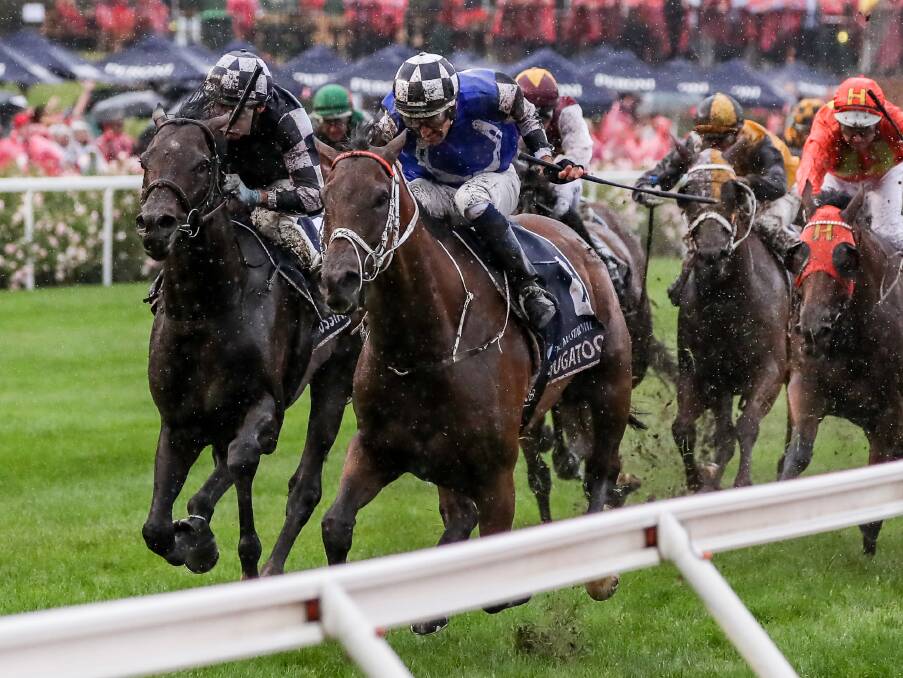 HIGH POINT: Mugatoo, with Hugh Bowman aboard, powers through the heavy ground to win the All Star Mile at Moonee Valley in 2021. Picture: Getty Images