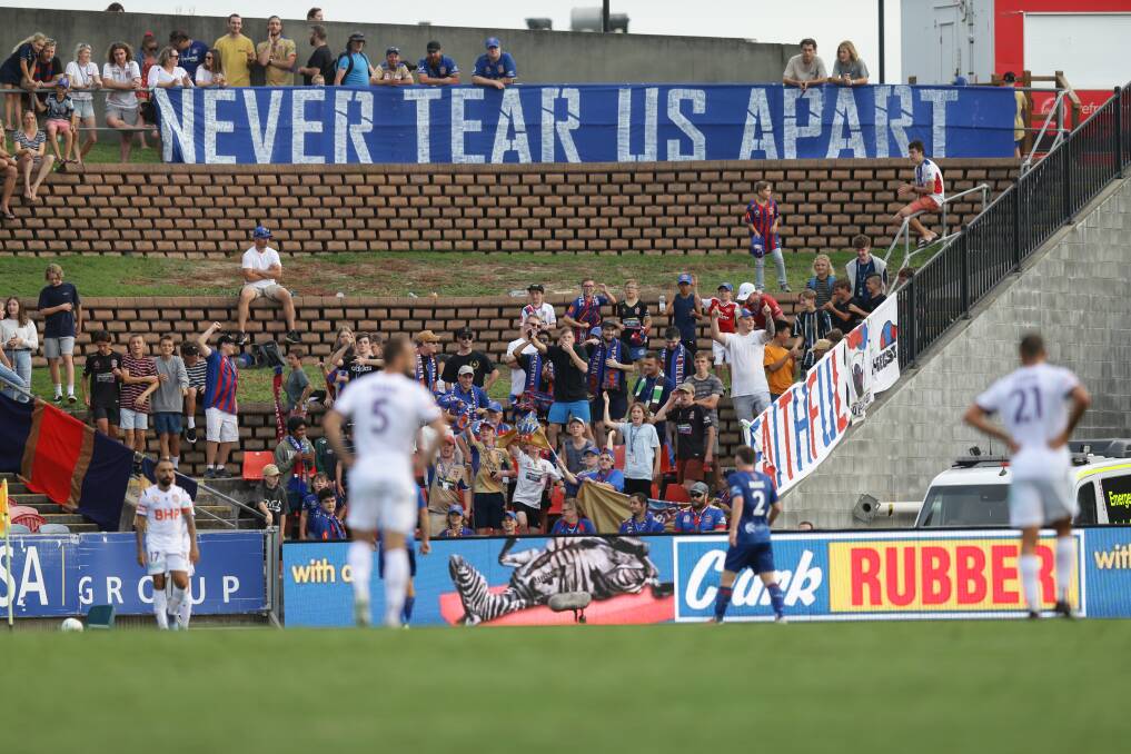 UNCERTAIN: Newcastle Jets fans show their support in a match against Perth in February at McDonald Jones Stadium. The A-League season could resume in July. Picture: Jonathan Carroll 