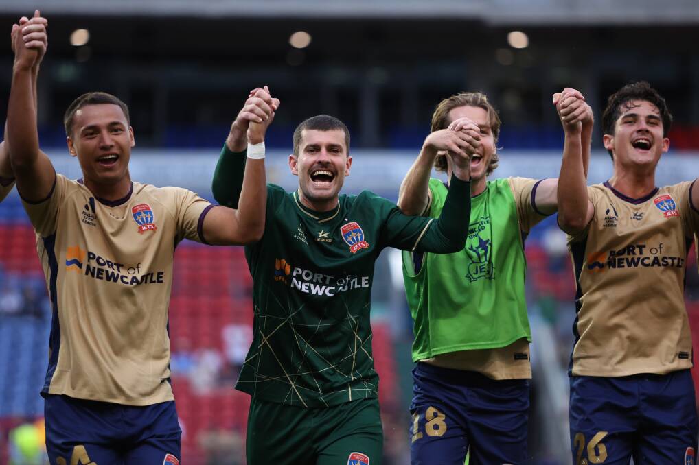 Jets players Dane Ingham, Ryan Scott, Daniel Stynes and Archie Goodwin celebrate their 2-0 win over Western United on Saturday. Picture by Scott Gardiner, Getty Images