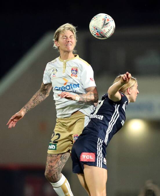 Larissa Crummer wins a header against Melbourne Victory. Picture: AAP