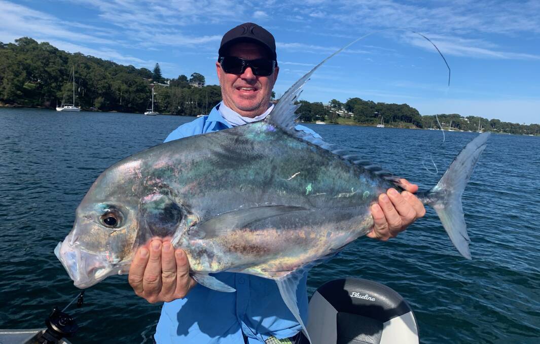 CROWNING GLORY: Troy King with the 90-centimetre diamond trevally he caught in Lake Macquarie on Sunday morning.