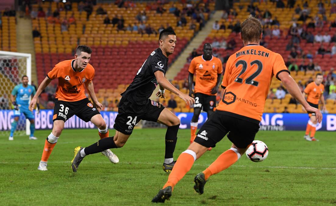 ROOM TO MOVE: Joey Champness on the attack against Brisbane Roar on Saturday night at Suncorp Stadium. Picture: AAP